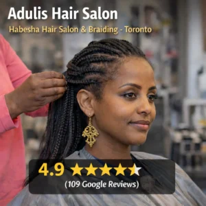 Eritrean woman getting her hair braided at Adulis Hair Salon in Toronto with 4.9-star Google reviews